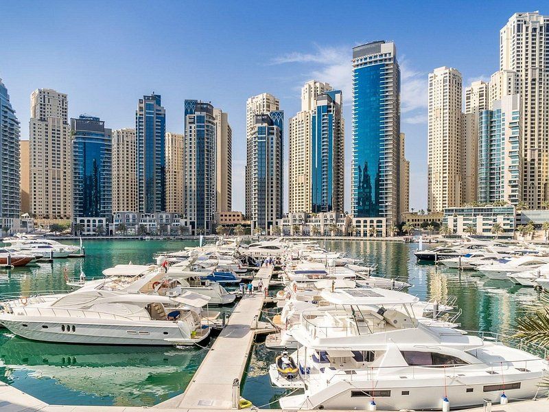 Yachts moored below the towers of Dubai Marina